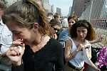 In a solemn, wordless ceremony marking the end of eight monyhs of cleanup from the terrorist attacks of September 11, 2001 which destroyed the twin towers of the World Trade Center, an empty stretcher is carried up the ramp from the pit, and the last steel column is carried out on a truck. An honor guard of police, firefighters, construction workers, and rescue personnel lined the ramp. Familes of victims were present as was Mayor Michael Bloomberg.