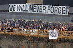 In a solemn, worldless ceremony marking wight months of cleanup from the terrorist attacks of September 11, 2001, which destroyed the twin towers of the World Trade Center, an empty stretcher is carried up the ramp from the pit, and the last steel column is carried out on a truck. An honor guard of police, firefighters, contruction workers, rescue personnel, and military lined the ramp. Families of victims were present as was Mayor Michael Bloomberg.