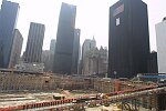 In a solemn, worldless ceremony marking eight months of cleanup from the terrorist attacks of September 11, 2001, which destroyed the twin towers of the World Trade Center, an empty stretcher is carried up the ramp from the pit, and the last steel column is carried out on a truck. An honor guard of police, firefighters, contruction workers, rescue personnel, and military lined the ramp. Families of victims were present as was Mayor Michael Bloomberg.