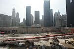 In a solemn, wordless ceremony marking the end of eight monyhs of cleanup from the terrorist attacks of September 11, 2001 which destroyed the twin towers of the World Trade Center, an empty stretcher is carried up the ramp from the pit, and the last steel column is carried out on a truck. An honor guard of police, firefighters, construction workers, and rescue personnel lined the ramp. Familes of victims were present as was Mayor Michael Bloomberg.