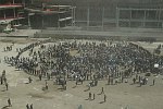 Families of the victims of the terror attacks on the World Trade Center in New York City which killed almost 3,000 people on 11 September 2001 commemorate the 1st anniversary of the tragedy on 11 September 2002.<br>Clouds of dust swirl up from the pit.