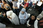 Muslim women participate in memorial anniversary ceremony at Ground Zero.