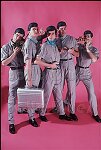 Devo pose in the 182 Duane St., NYC studio 10/81 for SoHo Weekly News Devo fashion feature