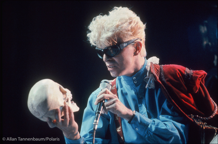 David Bowie contemplates a skull on tour in concert