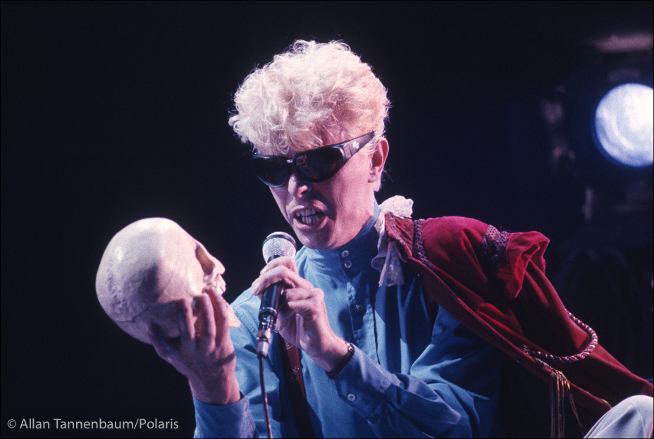 David Bowie contemplates a skull on tour in concert