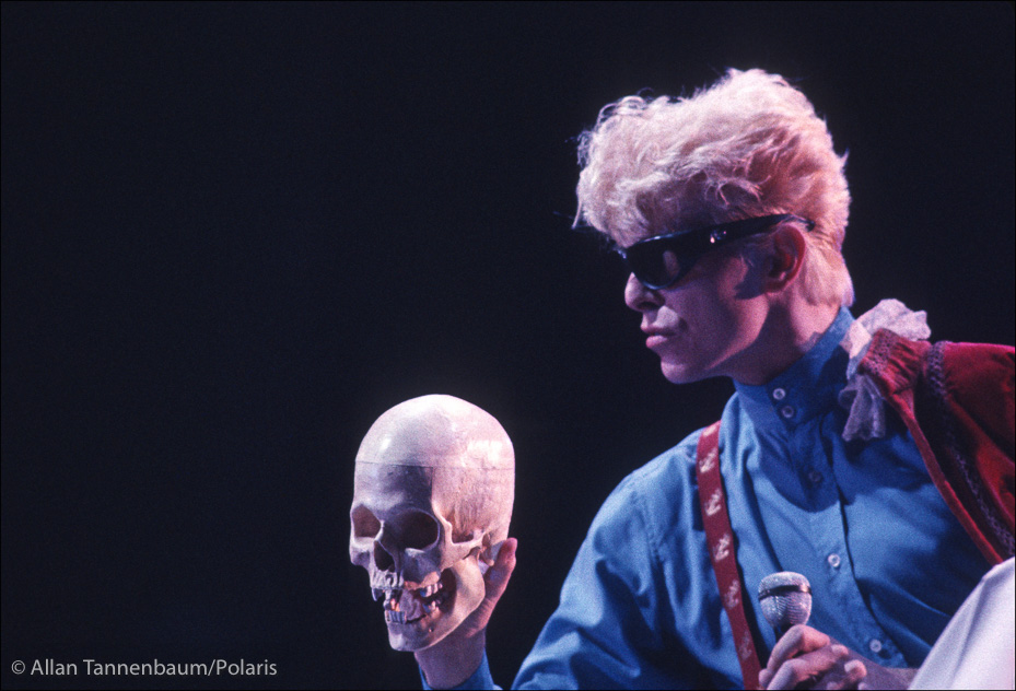 David Bowie contemplates a skull on tour in concert