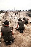 French troops de-mine the beach at Kuwait City after its liberaqtion from Iraq.