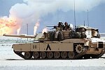 U.S. Troops on a mechanized march from Kuwait into Iraq with M1A1 Abrams tanks, M3 Bradley Fighting Vehicles, APCs, and other vehicles leave the burning oil fields into the Wadi Al-Bateen.