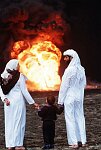 Kuwaiti family looking at burning oil wells near Kuwait City. Al Ahmadi, Kuwait<br>Colonel Saber al-Suwaidah, Kuwaiti officer held hostage in Iraq