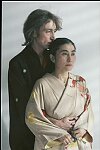 John Lennon and Yoko Ono during the filming of a video to promote their new album, &quotDouble Fantasy", New York City, November 26, 1980. Filming began in Central Park, then moved to a gallery on SoHo for scenes where they would arrive in a white bedroom, first in street clothes and later in kimonos, strip, and make love.<br><br>photo credit: Allan Tannenbaum