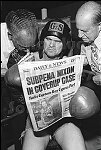 The boxer Snooks at Gleason's Gym reads about Nixon and Watergate<br>NYC 8/74<br>0279-18<br>From SoHo Blues - A Personal Photographic Diary of New York City in the 1970s by SoHo Weekly News chief photographer Allan Tannenbaum