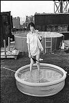 Up and coming punk poet and rock star Patti Smith drops her undies on a SoHo rooftop.<br>NYC 7/74<br>0264-27<br>From SoHo Blues - A Personal Photographic Diary of New York City in the 1970s by SoHo Weekly News chief photographer Allan Tannenbaum