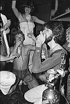 Revelers inhaling nitrous oxide - laughing gas - at Studio 54, Halloween, 10/31/77<br>1842-20<br>From SoHo Blues - A Personal Photographic Diary of New York City in the 1970s by SoHo Weekly News chief photographer Allan Tannenbaum