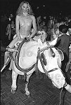&quotLady Godiva" on a white horse at Studio 54 for the Purple Magazine party, 9/15/77 NYC<br>1760-06<br>From SoHo Blues - A Personal Photographic Diary of New York City in the 1970s by SoHo Weekly News chief photographer Allan Tannenbaum