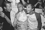 Halston, Roy Cohn, and Steve Rubell, all dead of AIDS, at a Victor Hugo performance at The Mudd Club, NYC, 7/17/79<br>2674-09<br>From SoHo Blues - A Personal Photographic Diary of New York City in the 1970s by SoHo Weekly News chief photographer Allan Tannenbaum