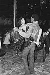 Bianca Jagger dances with model Sterling St. Jacques at Studio 54, 5/4/77<br>1537-08<br>From SoHo Blues - A Personal Photographic Diary of New York City in the 1970s by SoHo Weekly News chief photographer Allan Tannenbaum