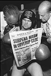 The boxer Snooks at Gleason's Gym reads about Nixon and Watergate<br>NYC 8/74<br>0279-18<br>From SoHo Blues - A Personal Photographic Diary of New York City in the 1970s by SoHo Weekly News chief photographer Allan Tannenbaum