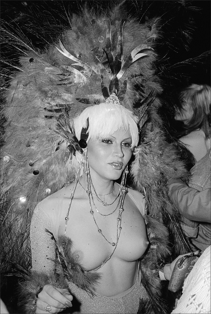 Bare-Breasted Lady in Peacock Feather Headdress