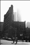 The Twin Towers of the World Trade Center viewed from White St. and 6th Ave., 9/1975<br>SN 0766-19<br>SWN