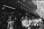 Shoppers leaving Job Lot Trading at Church and Chambers Streets, 11/1976<br>SN 1324-25A<br>SWN