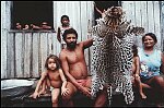 Settlers in the Brazilian Amazon display the skin of an Ona 1992