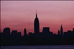 The New York City skyline seen from New Jersey at dawn shows no lights due to the electric blackout of 1977.