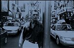 Jazz musician Georgie Fame in Times Square, NYC, 1999