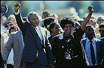 Accompanied by his wife Winnie and supporters, anti-apartheid fighter Nelson Mandela walks out of Victor Verster Prison near Cape Town, South Africa, February 11, 1990, a free man after 26 years of imprisonment.
